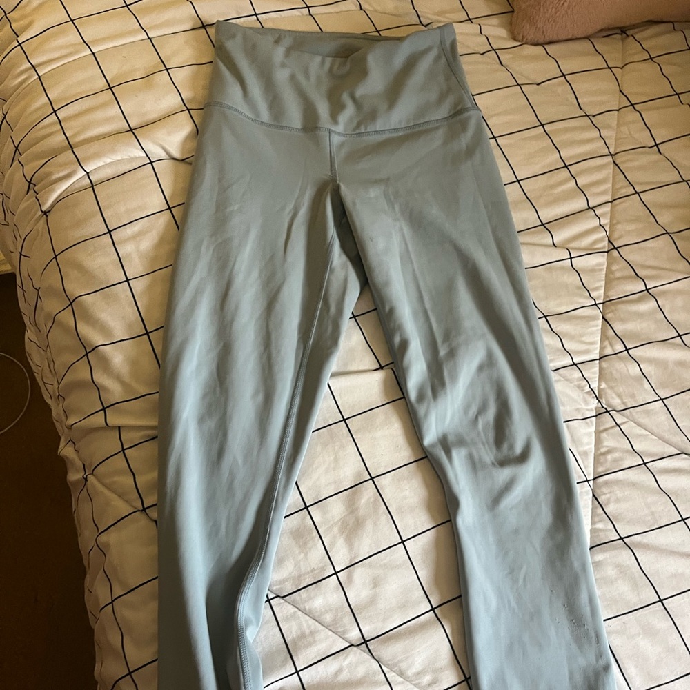 light blue leggings, tag is a little faded but still in great shape. barely worn